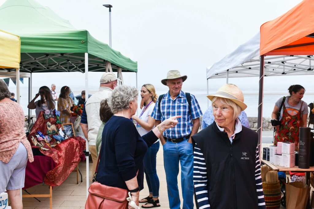 a group of people at an outdoor market