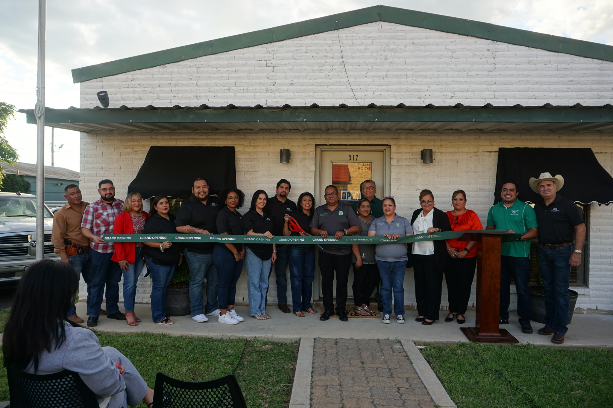 ribbon cutting group picture elected officials